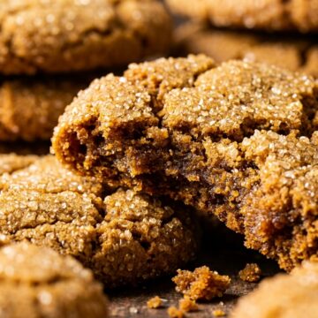 Ultra close-up macro stack of soft and chewy ginger molasses crinkle cookies