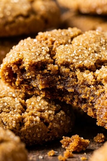 Ultra close-up macro stack of soft and chewy ginger molasses crinkle cookies