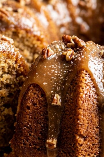 Ultra close-up macro of glazed apple cider bundt cake with caramel drizzle