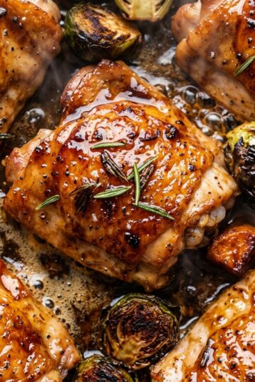 Sizzling roasted honey balsamic chicken thighs with caramelized Brussels sprouts and sweet potatoes