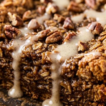 Ultra close-up macro of spiced gingerbread baked oatmeal slice with vanilla glaze